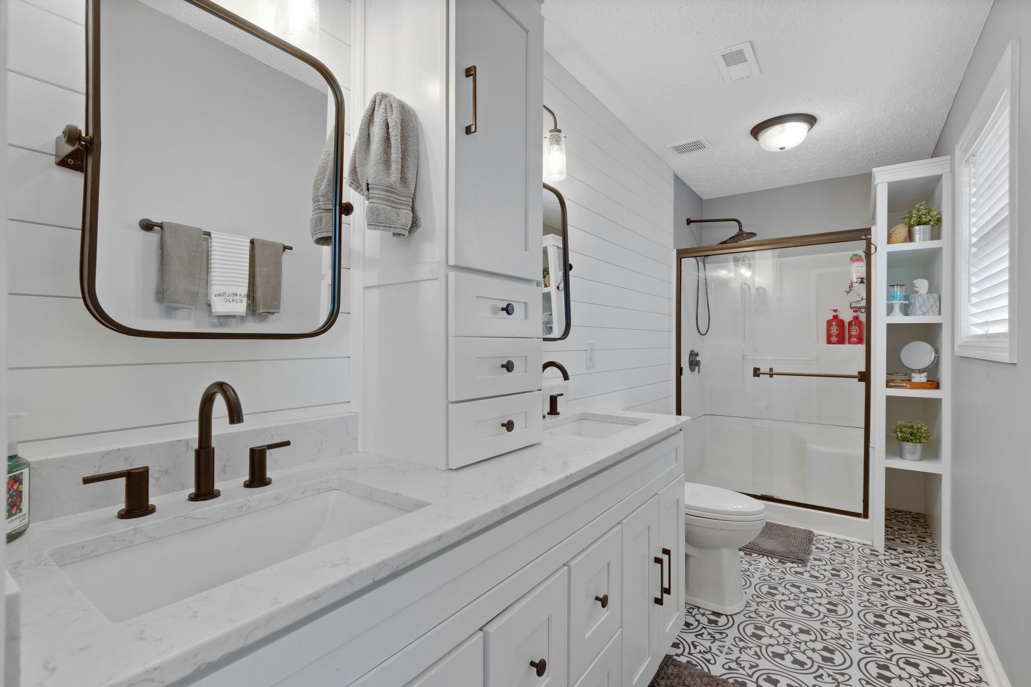 2137 Lee Road Spring Hill, TN 37174 - Photo 23 of 49 a bathroom with a double vanity sink a toilet and a mirror