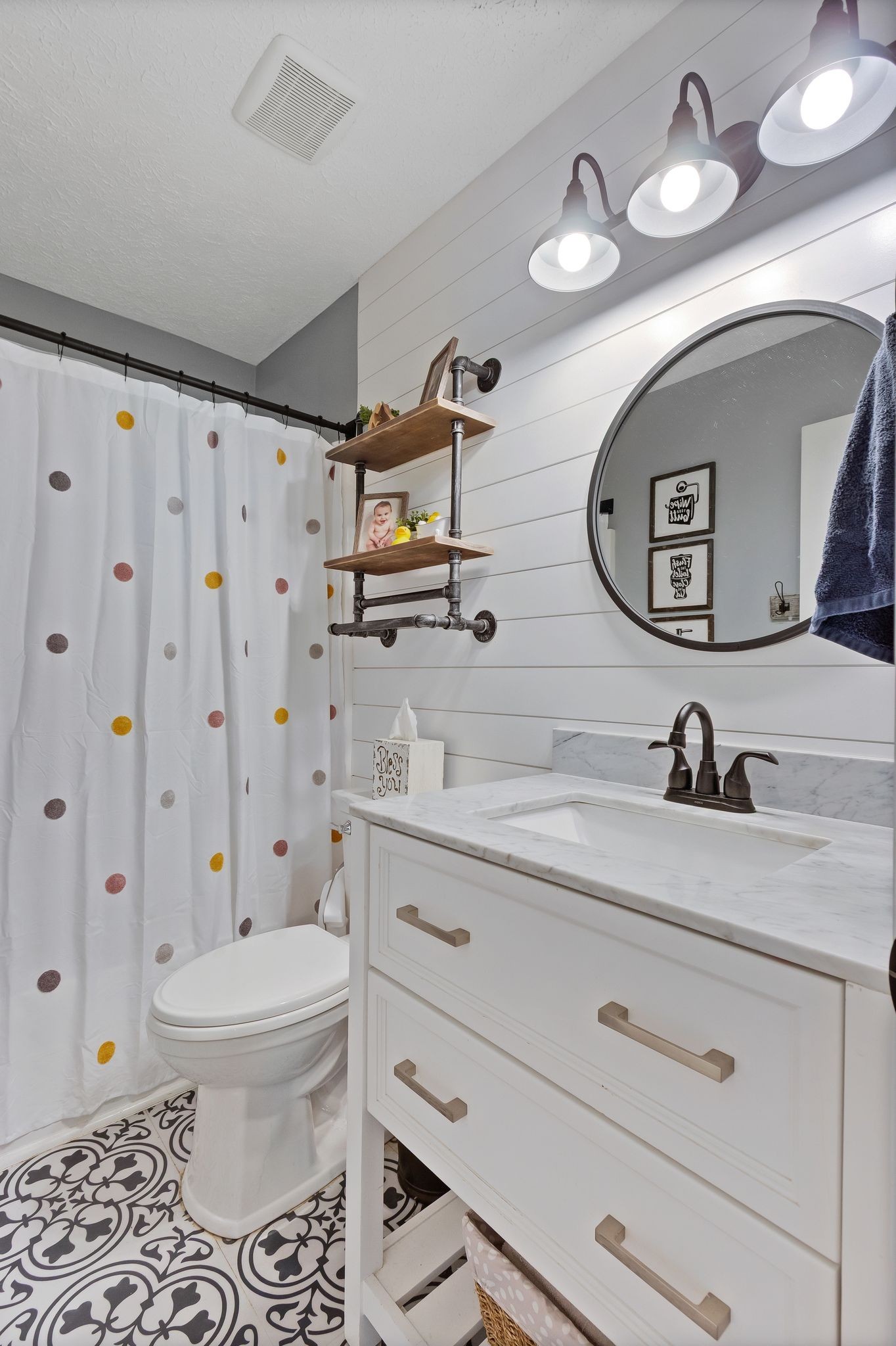 2137 Lee Road Spring Hill, TN 37174 - Photo 28 of 49 a bathroom with a toilet a sink and mirror