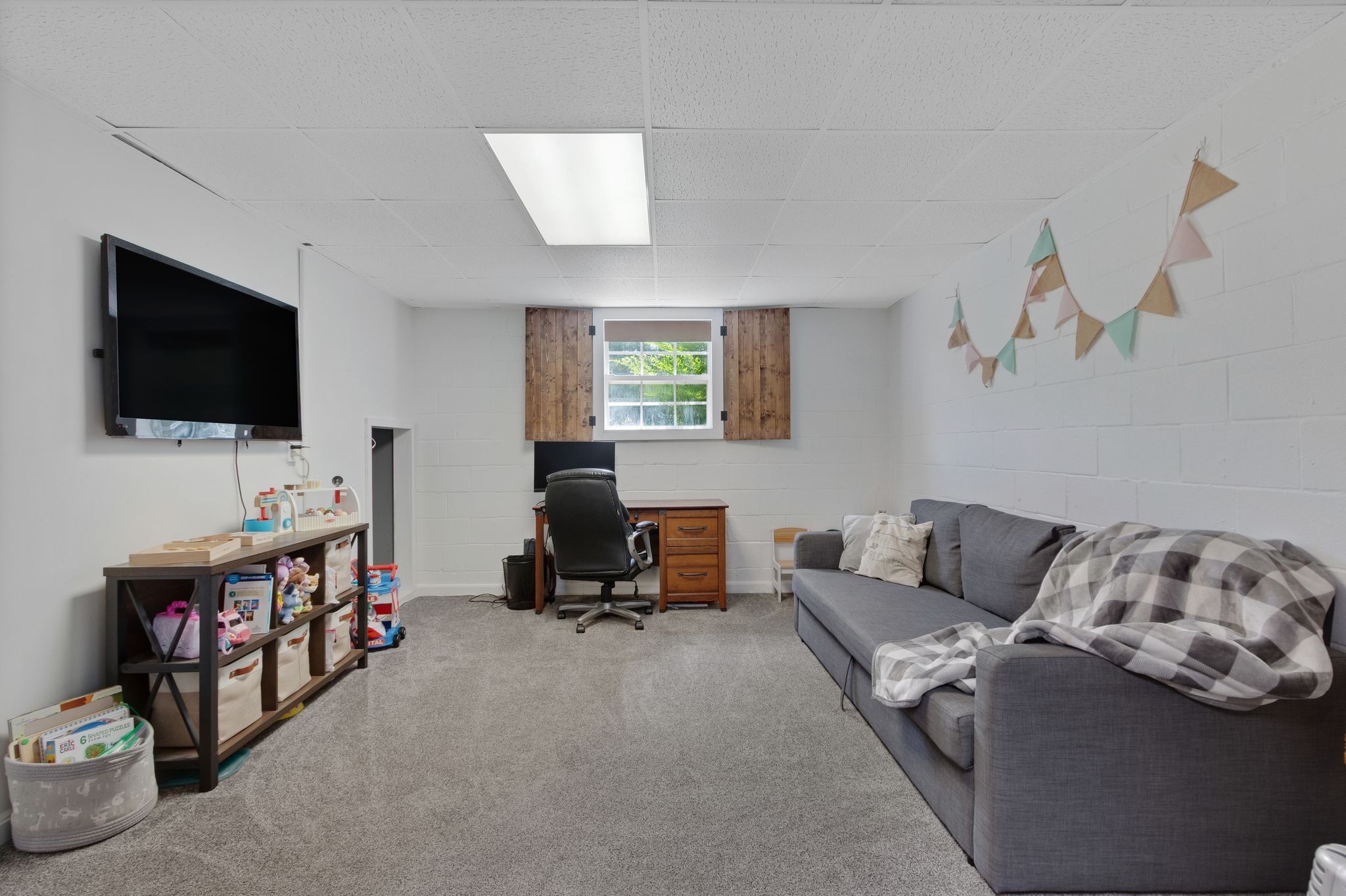 2137 Lee Road Spring Hill, TN 37174 - Photo 30 of 49 a living room with furniture and a flat screen tv