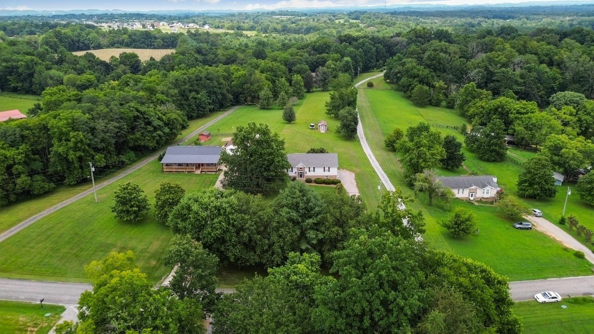 2137 Lee Road Spring Hill, TN 37174 - Photo 3 of 49 an aerial view of residential house with outdoor space and trees all around