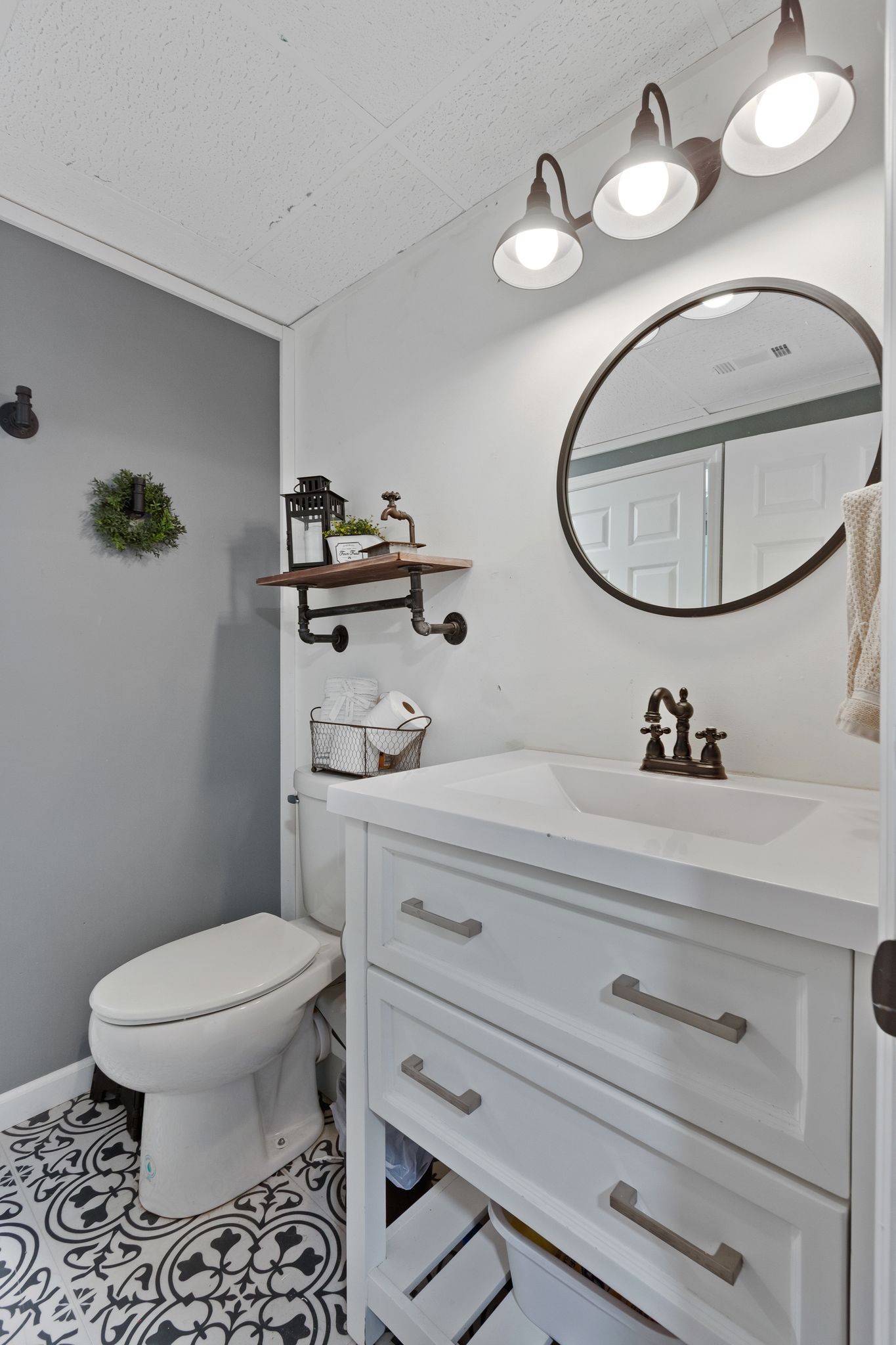 2137 Lee Road Spring Hill, TN 37174 - Photo 33 of 49 a bathroom with a toilet a sink and mirror