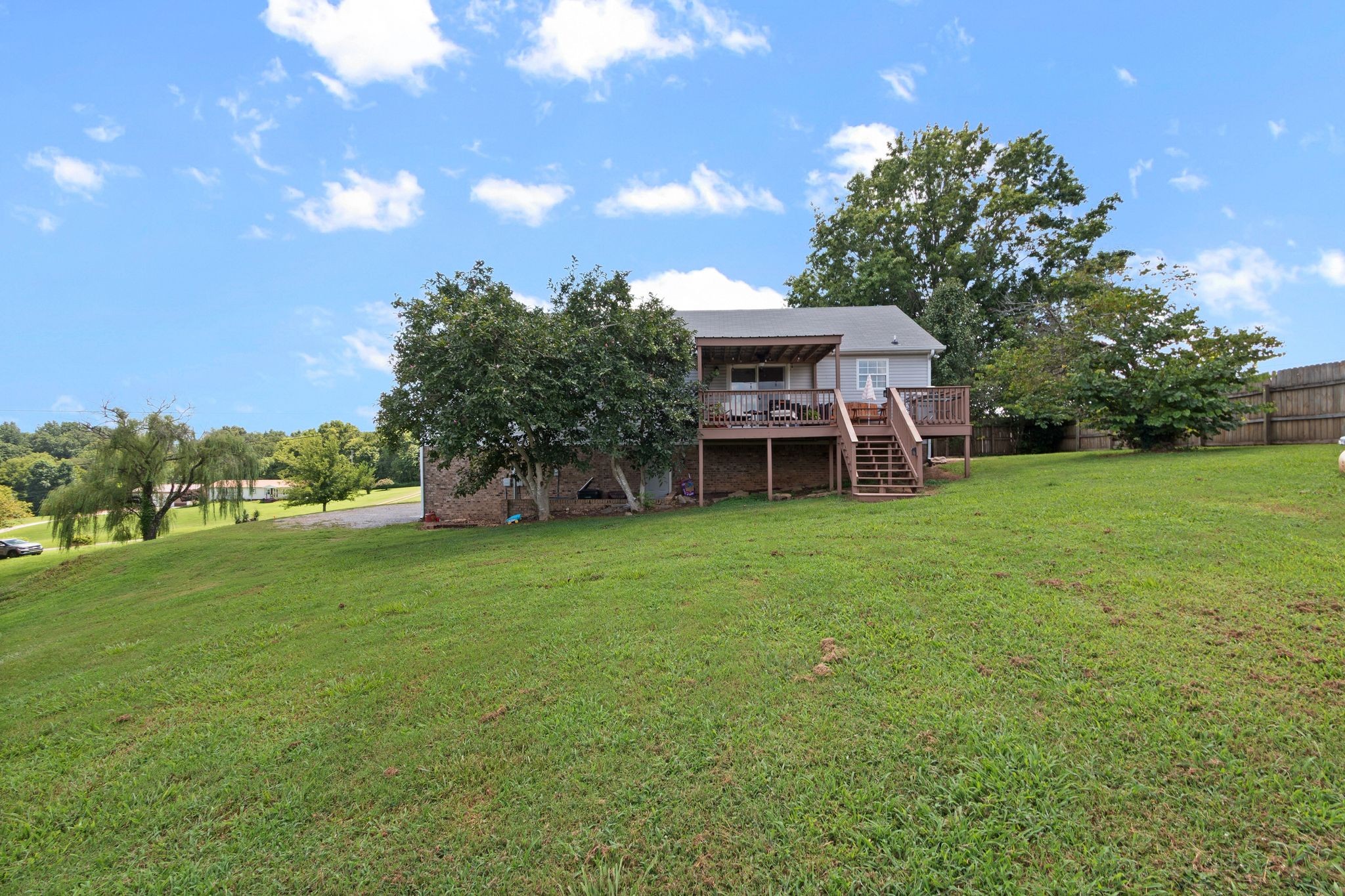 2137 Lee Road Spring Hill, TN 37174 - Photo 37 of 49 a backyard of a house with table and chairs