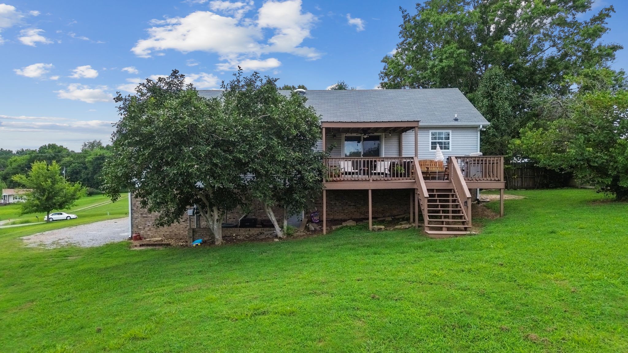 2137 Lee Road Spring Hill, TN 37174 - Photo 41 of 49 a view of a house with a yard and sitting area