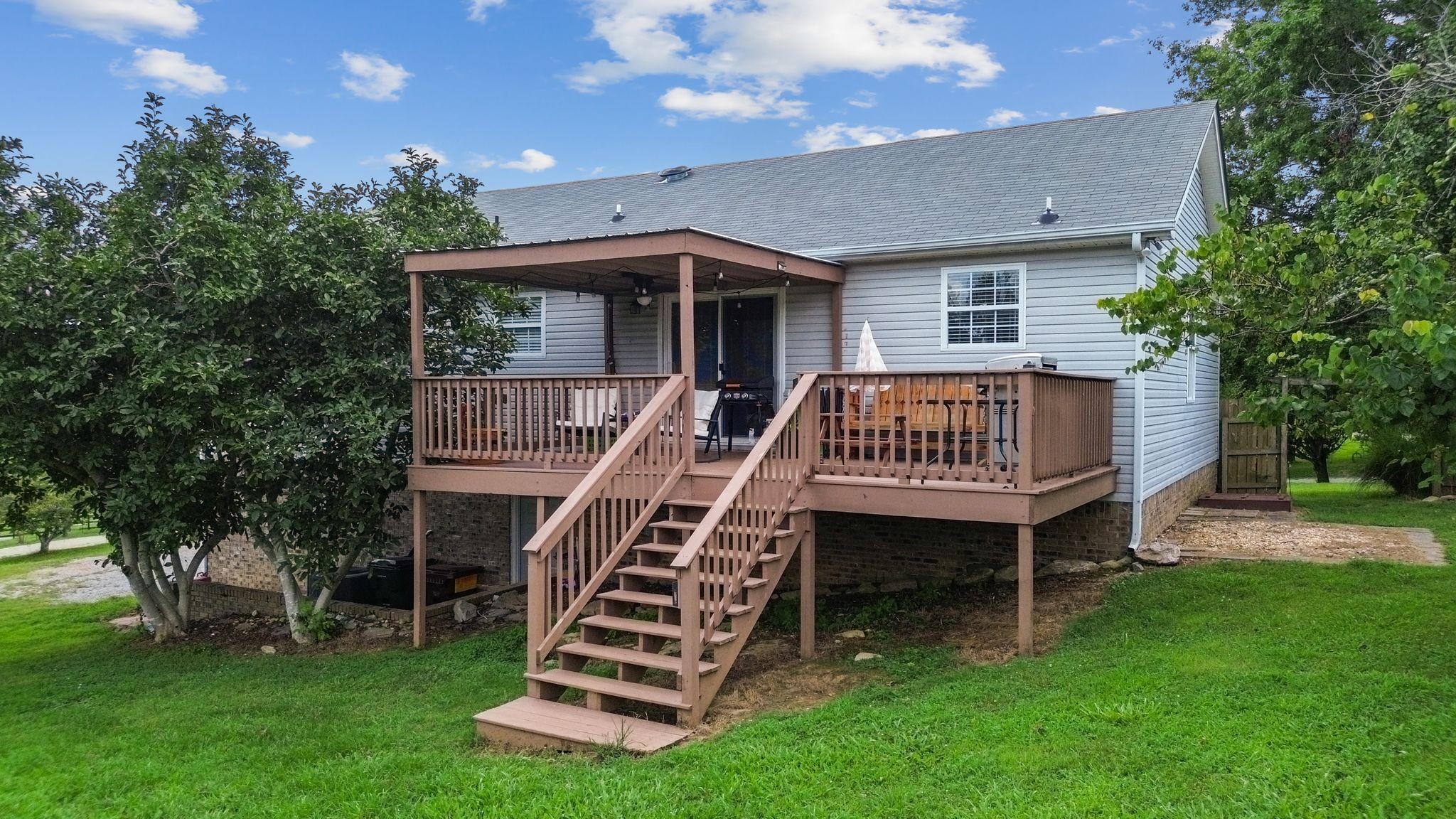 2137 Lee Road Spring Hill, TN 37174 - Photo 42 of 49 a view of a house with a yard and deck