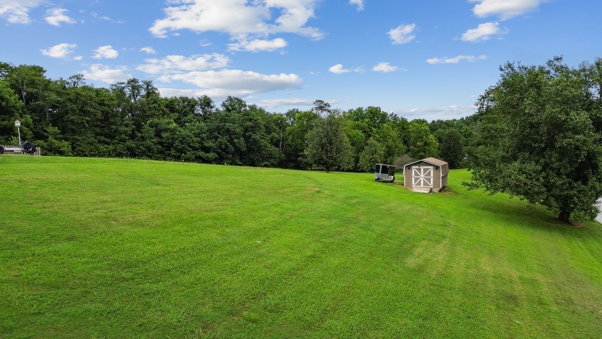 2137 Lee Road Spring Hill, TN 37174 - Photo 43 of 49 a view of a field with a tree in the background