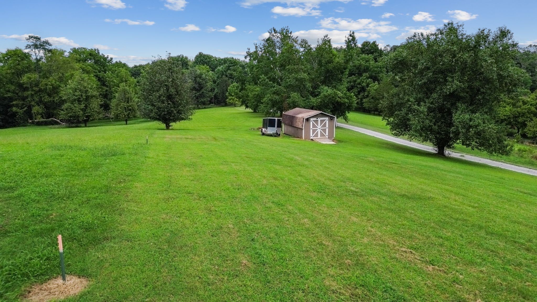 2137 Lee Road Spring Hill, TN 37174 - Photo 44 of 49 a view of a wooden deck and a yard
