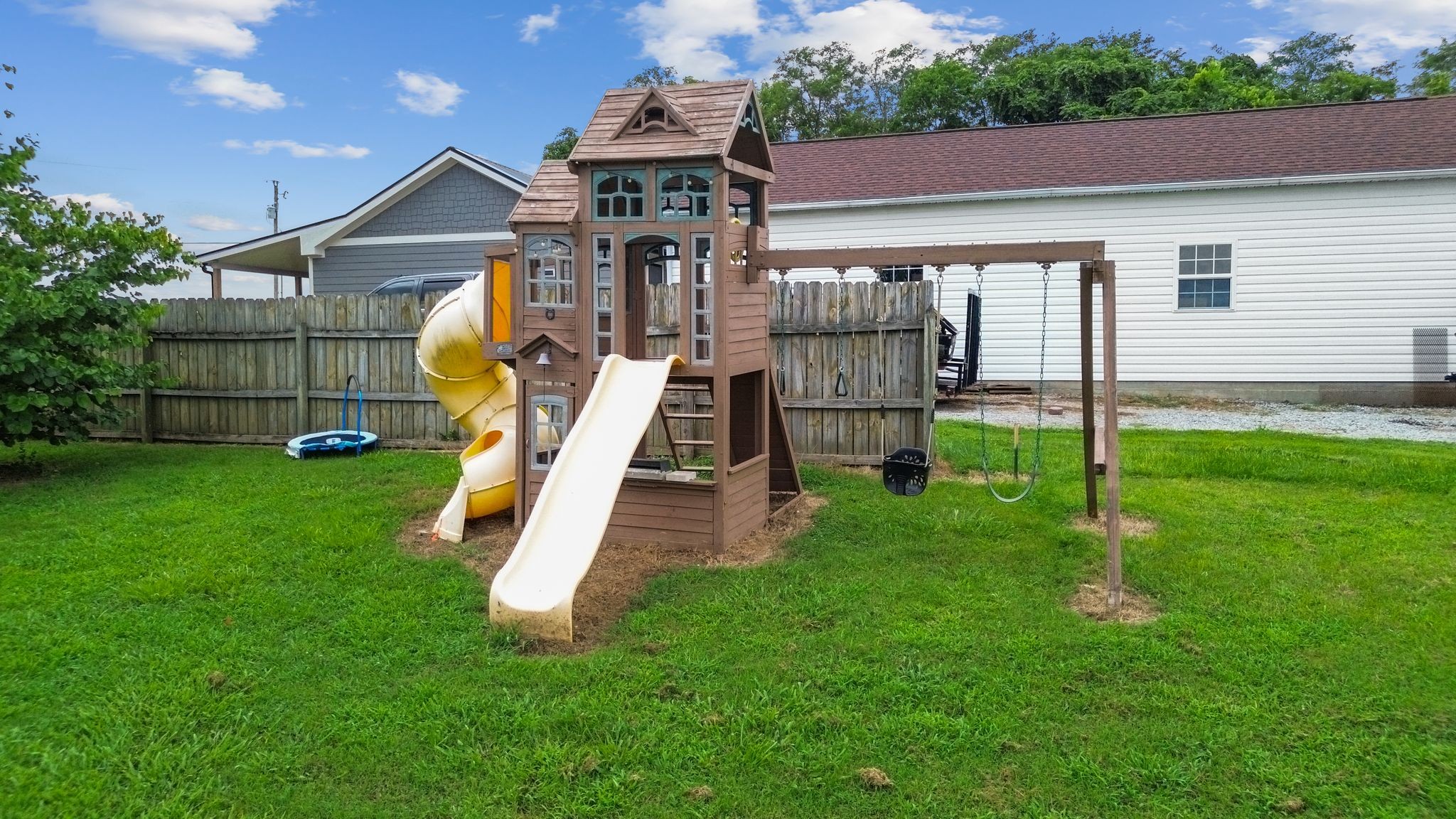 2137 Lee Road Spring Hill, TN 37174 - Photo 46 of 49 a view of a house with a backyard and a slide