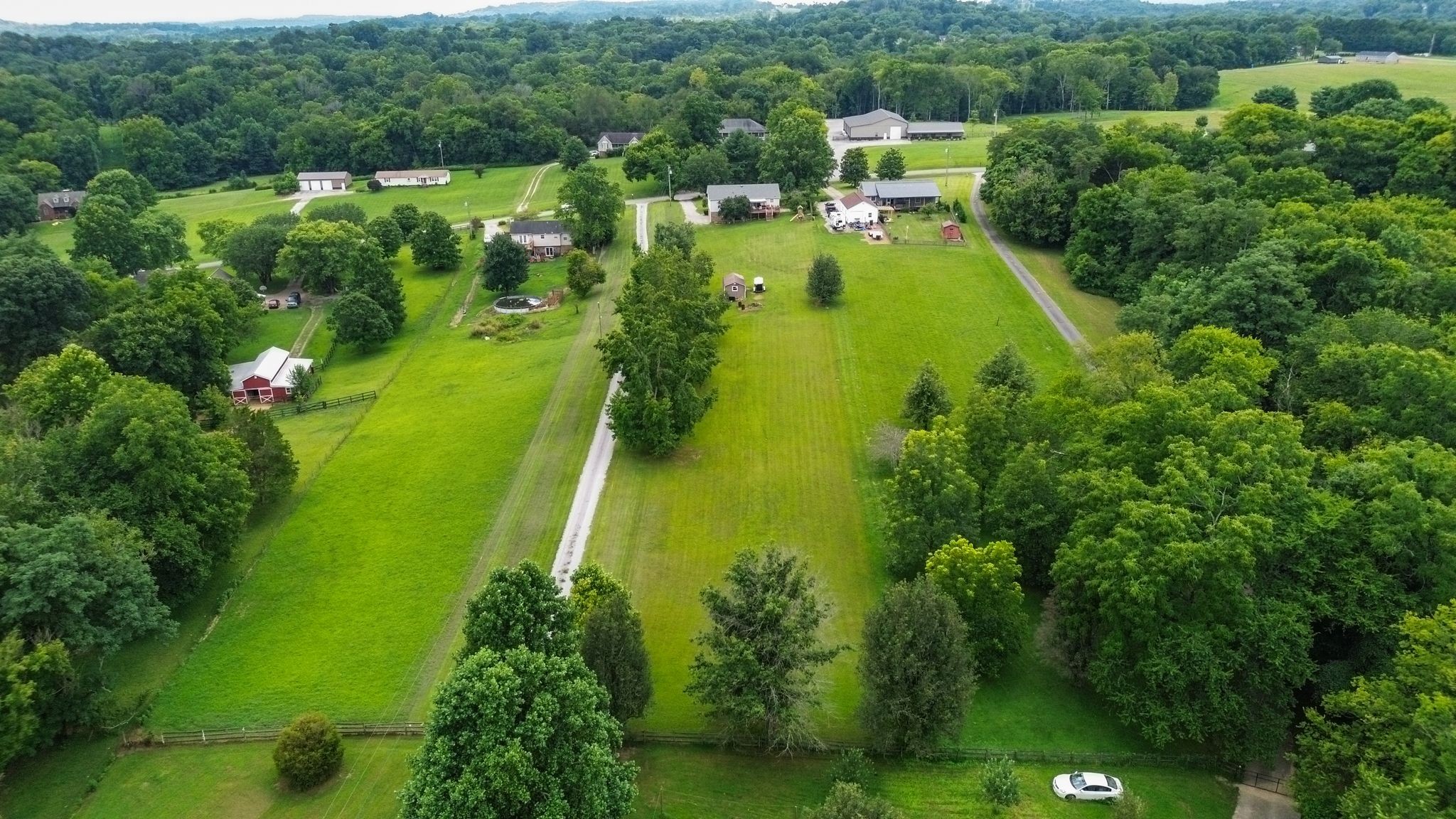 2137 Lee Road Spring Hill, TN 37174 - Photo 48 of 49 an aerial view of residential houses with outdoor space and trees all around