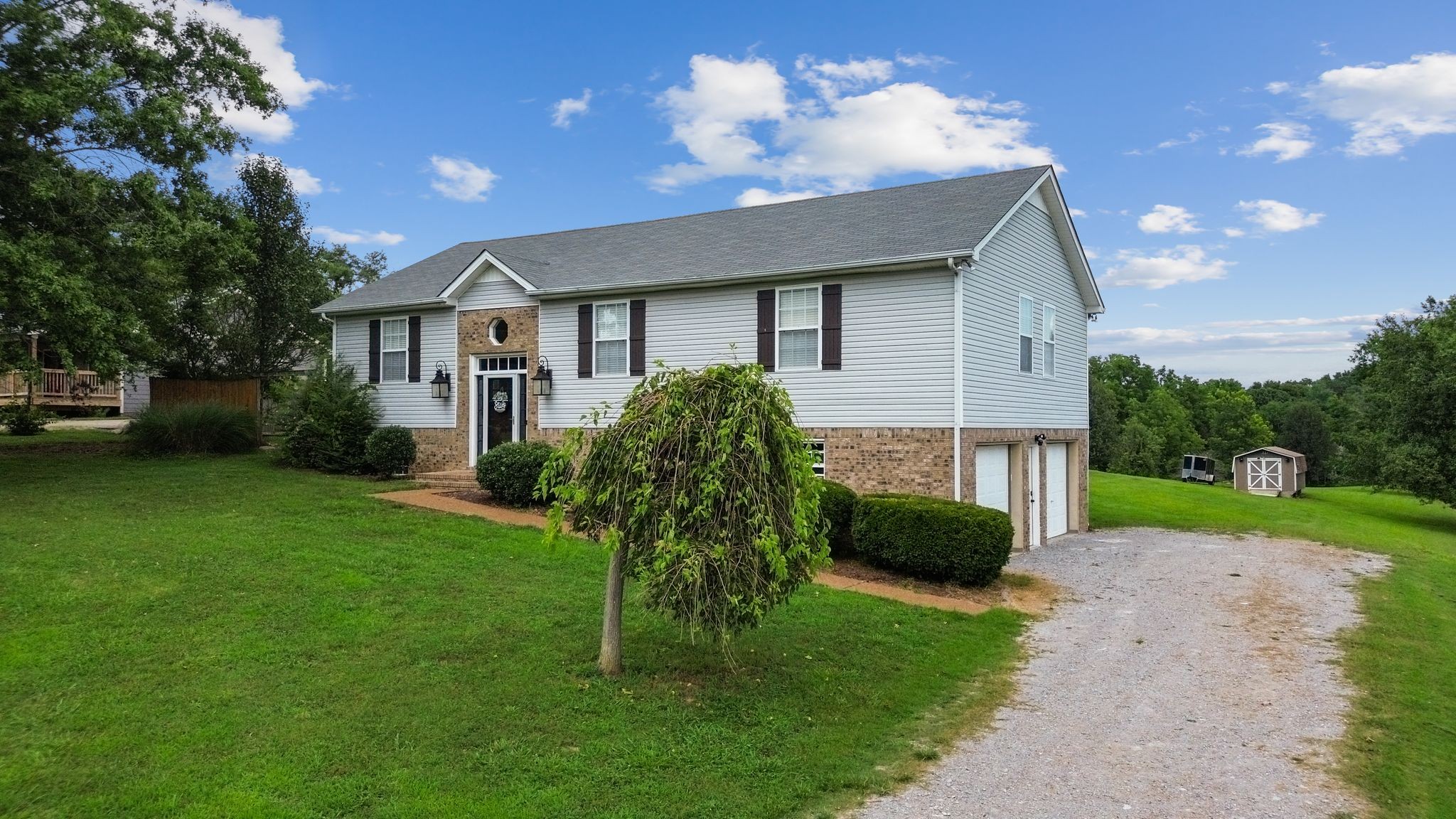 2137 Lee Road Spring Hill, TN 37174 - Photo 6 of 49 a front view of a house with garden
