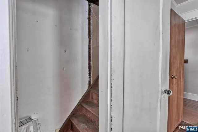 a view of a hallway with the door