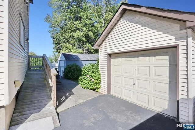 a view of front door and a garage