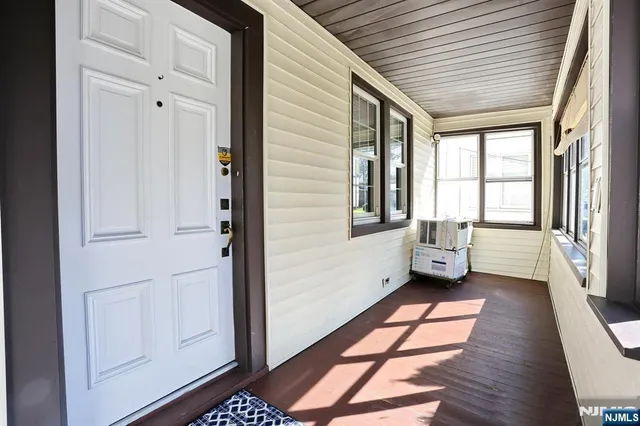 a view of an entryway with bedroom and balcony