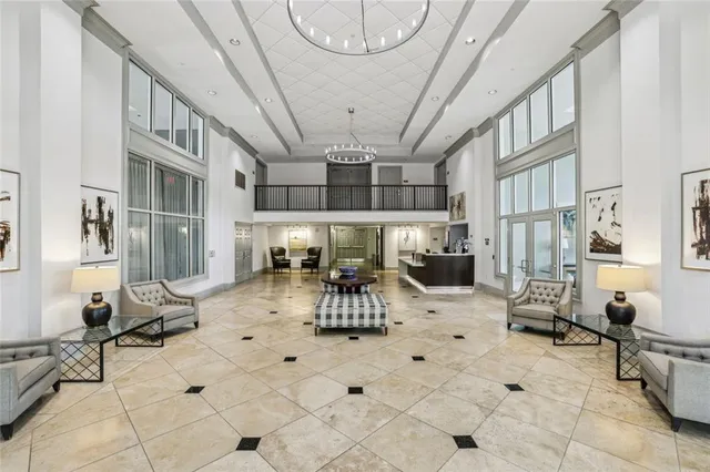 a view of a livingroom with furniture and a chandelier