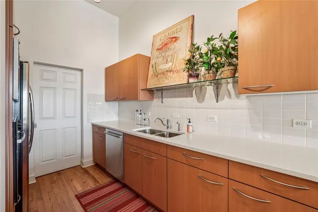 a kitchen with a sink and cabinets
