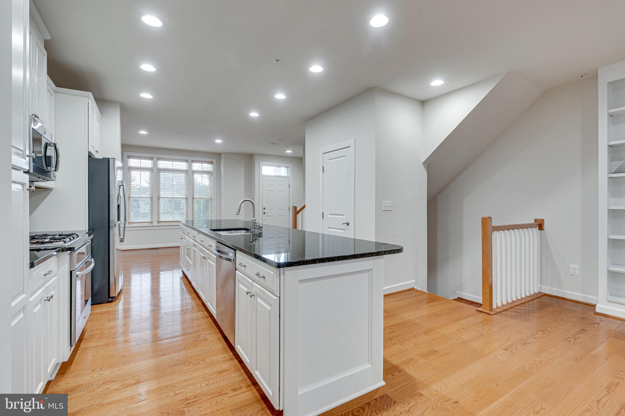 11357 Ridgeline Road Fairfax, VA 22030 - Photo 11 of 57 a kitchen with stainless steel appliances granite countertop a sink and stove