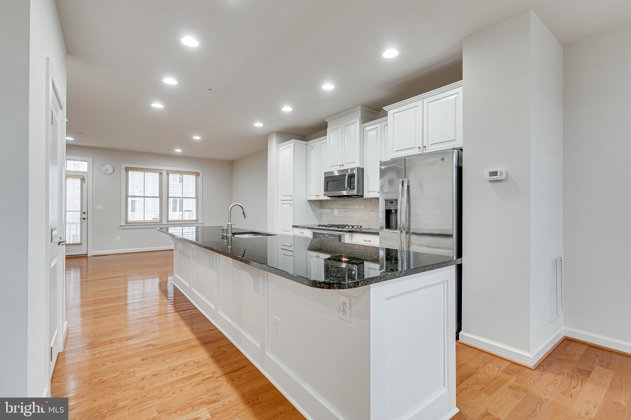 11357 Ridgeline Road Fairfax, VA 22030 - Photo 12 of 57 a large kitchen with stainless steel appliances lots of counter space and a refrigerator