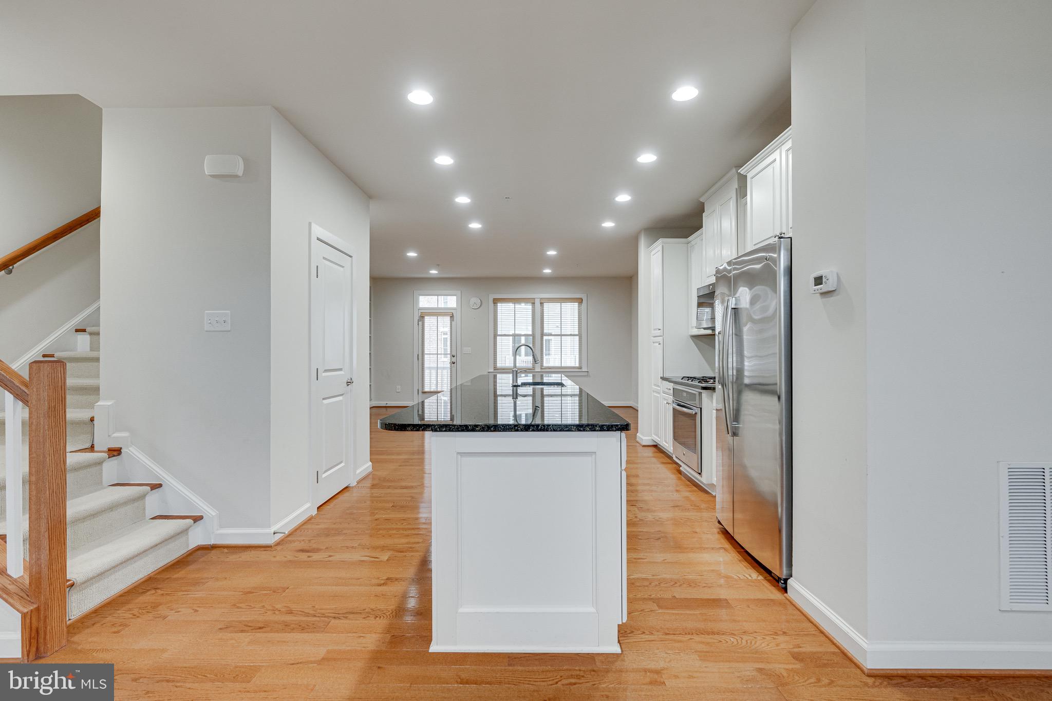 11357 Ridgeline Road Fairfax, VA 22030 - Photo 13 of 57 a view of a kitchen with stainless steel appliances granite countertop a refrigerator and a sink
