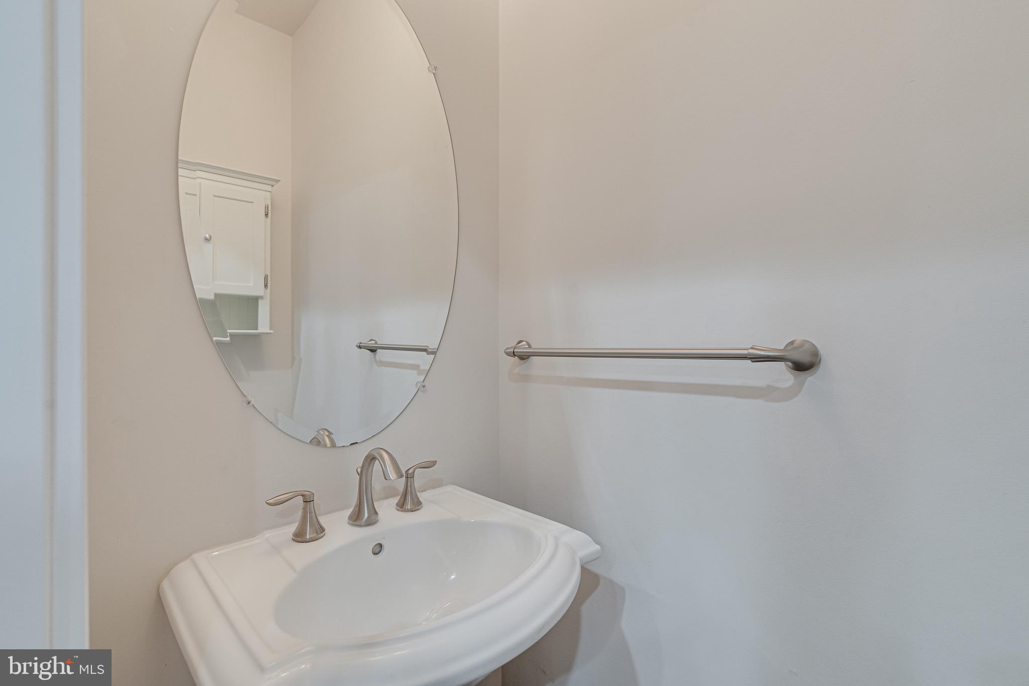 11357 Ridgeline Road Fairfax, VA 22030 - Photo 21 of 57 a bathroom with a sink and mirror