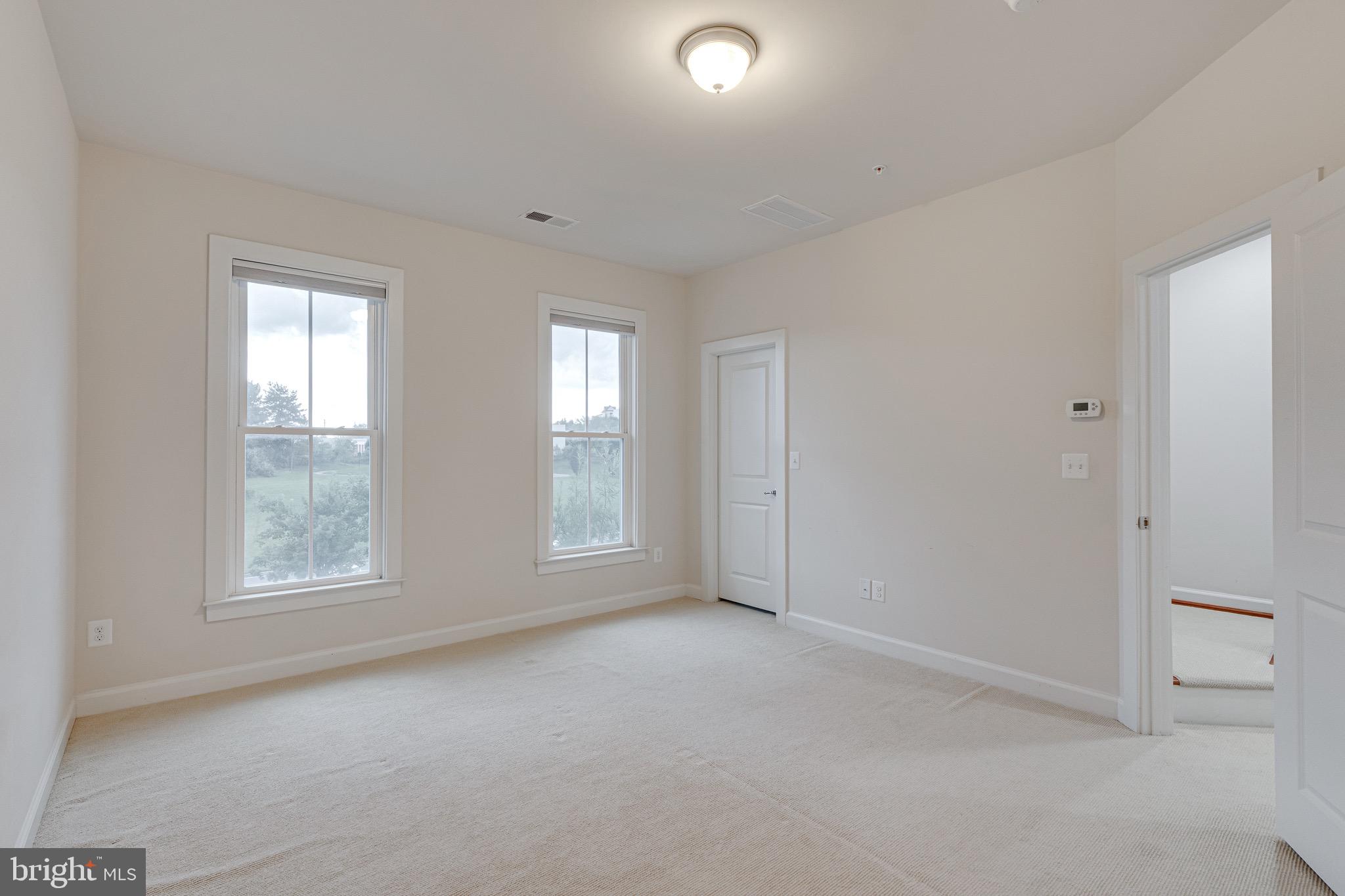 11357 Ridgeline Road Fairfax, VA 22030 - Photo 23 of 57 an empty room with windows