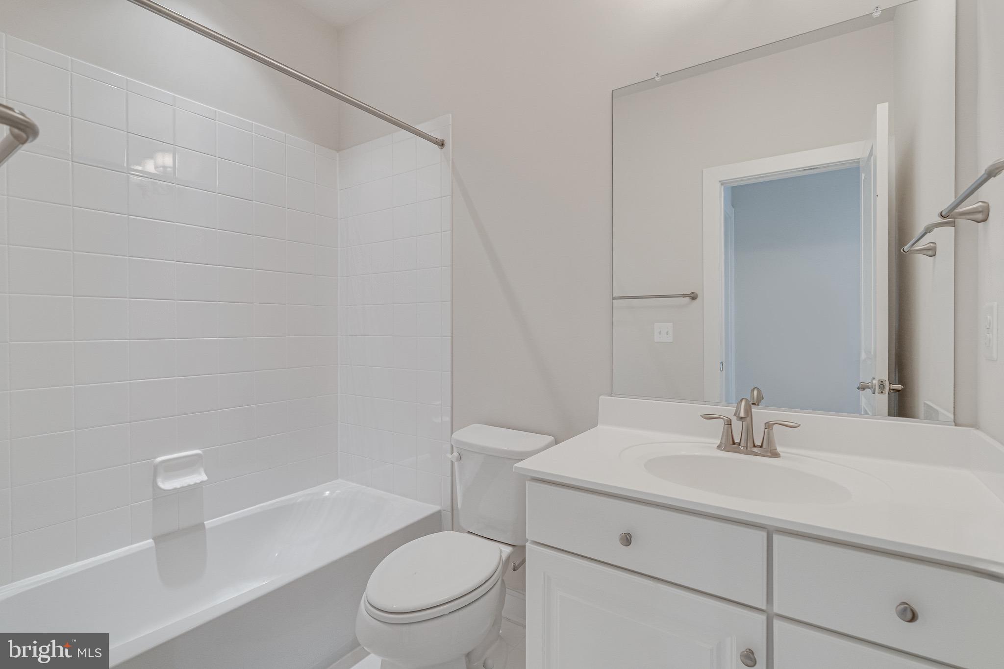 11357 Ridgeline Road Fairfax, VA 22030 - Photo 46 of 57 a bathroom with a sink a toilet and shower