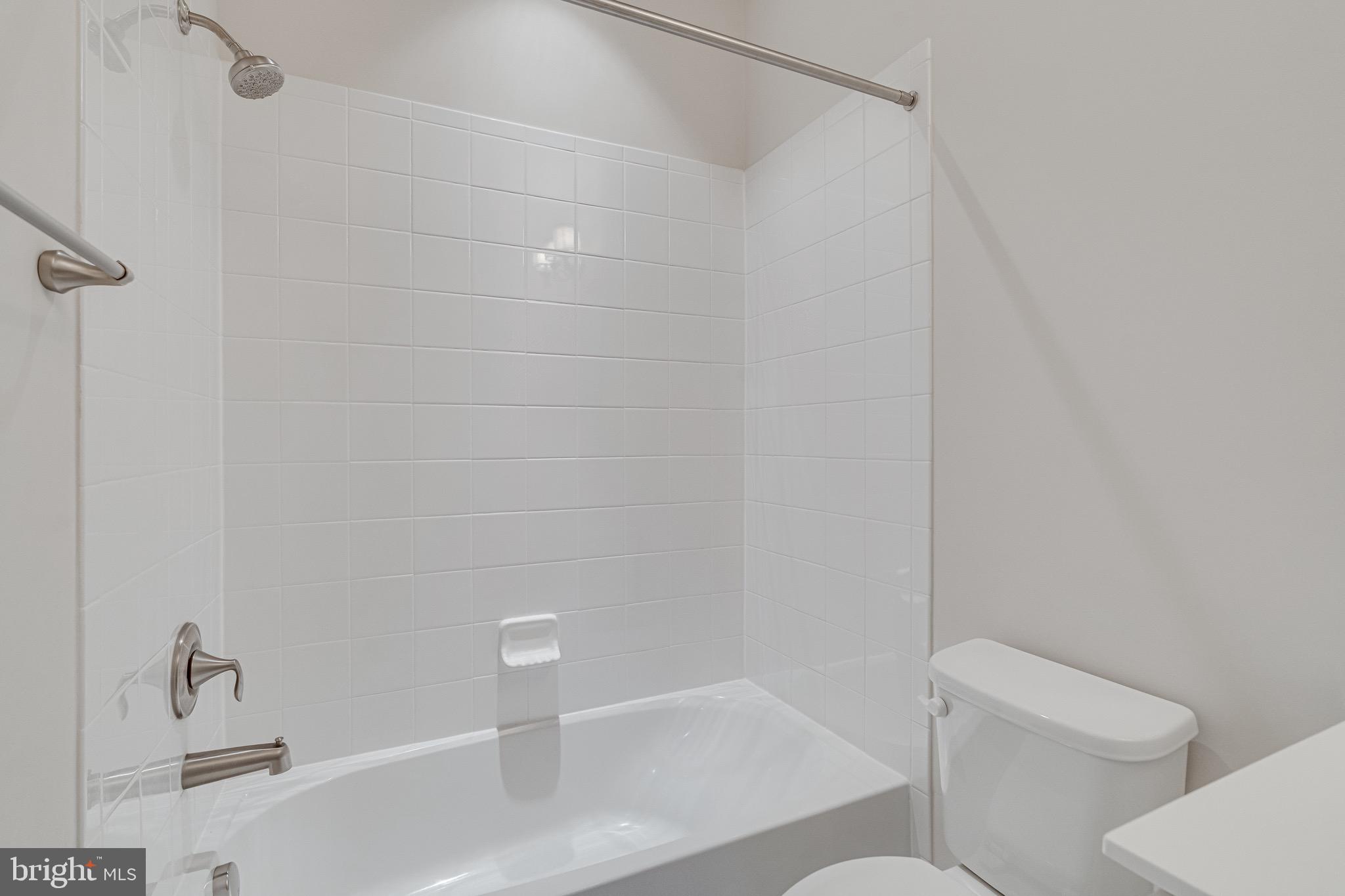 11357 Ridgeline Road Fairfax, VA 22030 - Photo 47 of 57 a bathroom with a shower and toilet