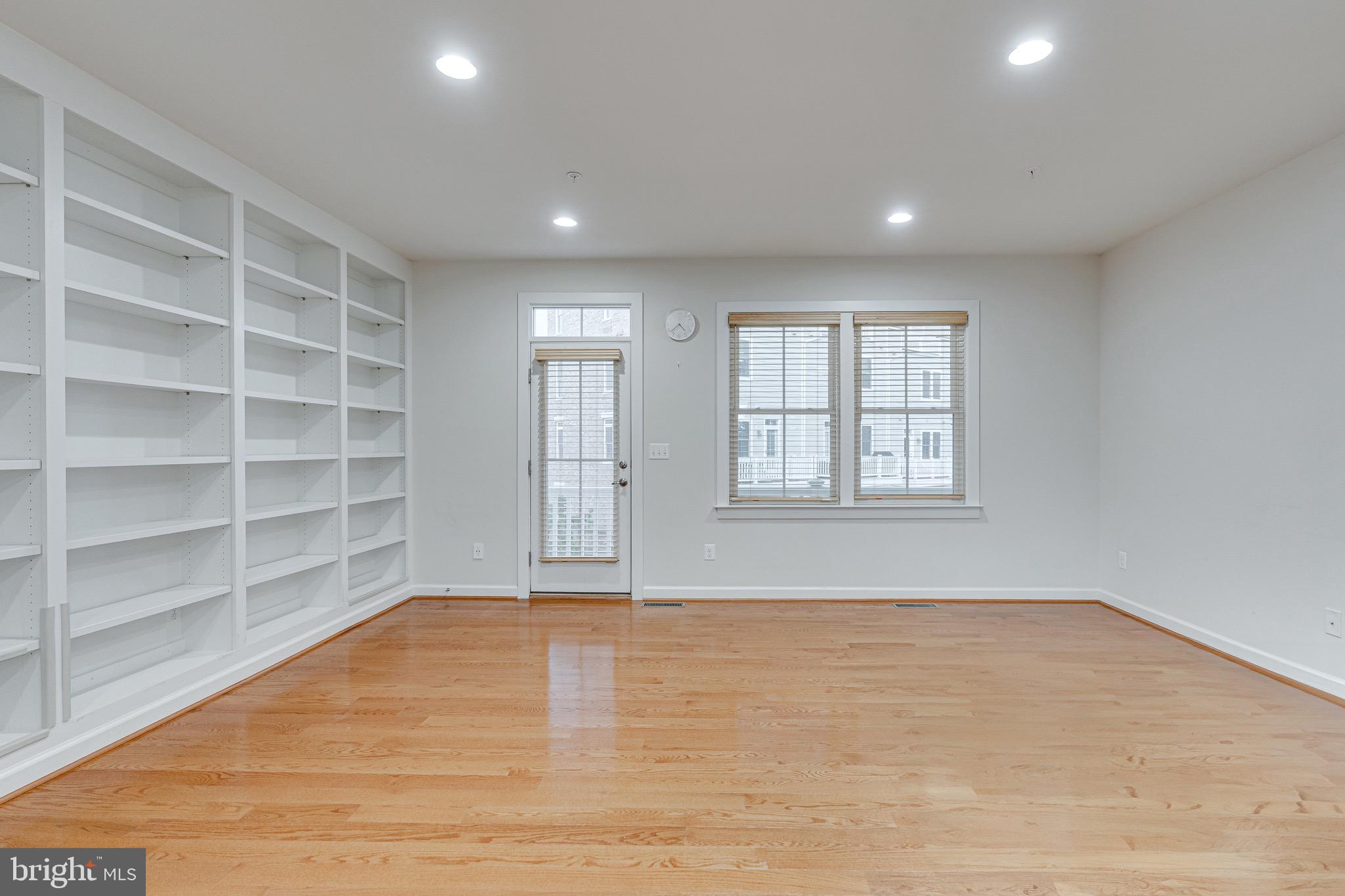 11357 Ridgeline Road Fairfax, VA 22030 - Photo 5 of 57 a view of an empty room with a window and wooden floor
