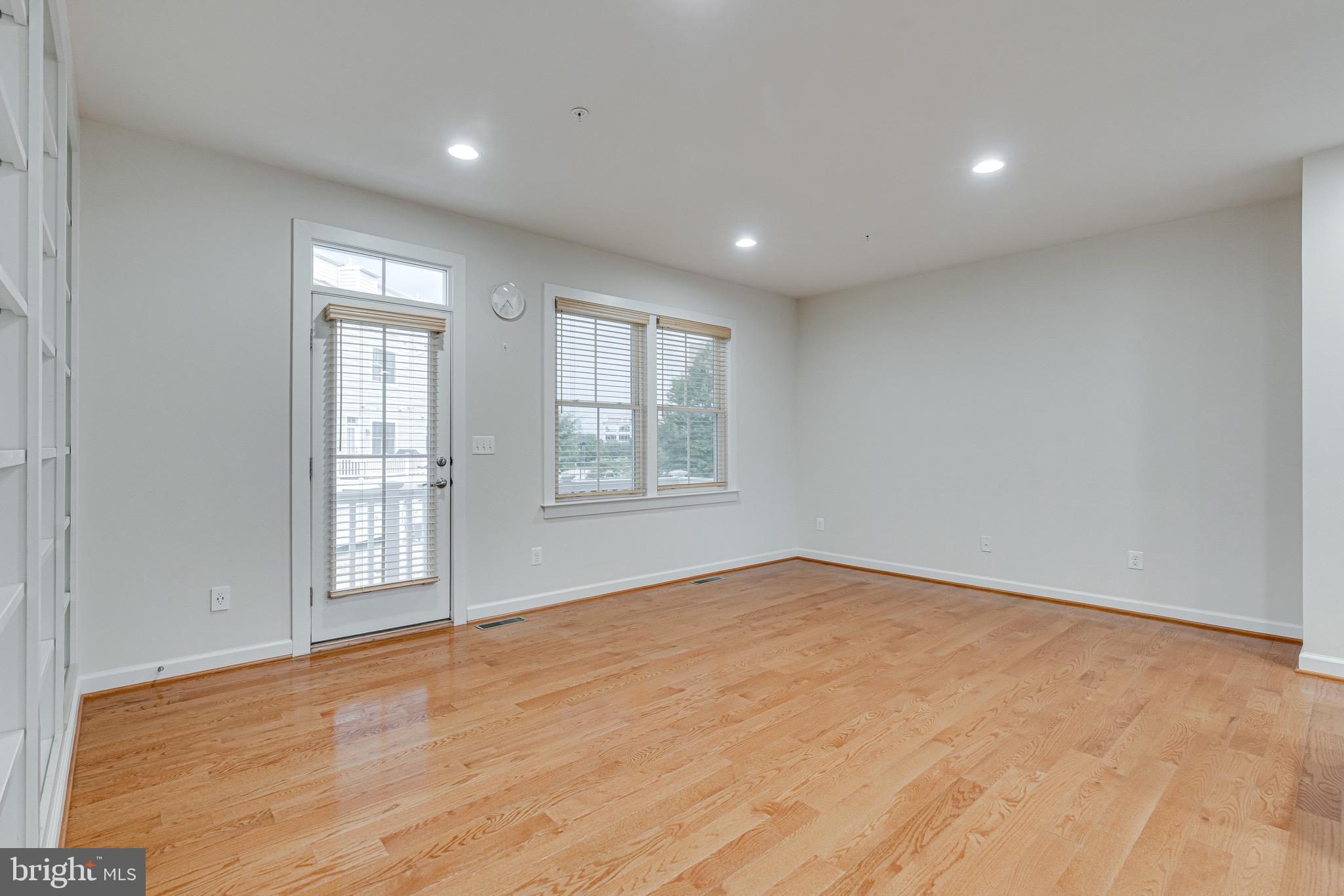 11357 Ridgeline Road Fairfax, VA 22030 - Photo 6 of 57 wooden floor in an empty room with a window