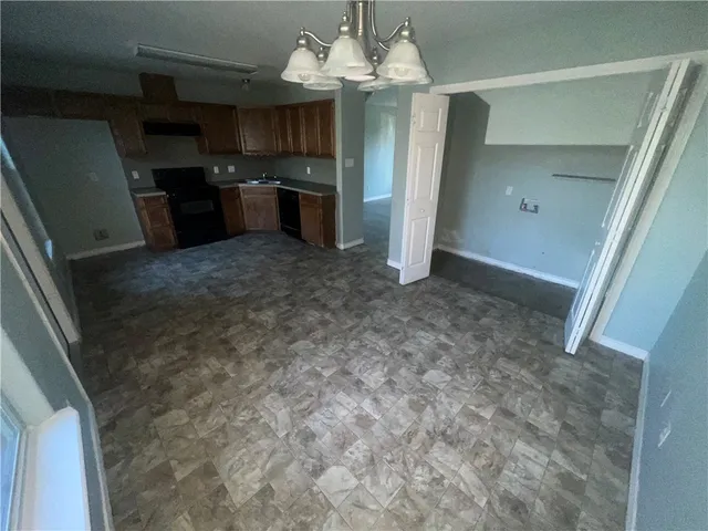 a view of a kitchen with refrigerator and microwave