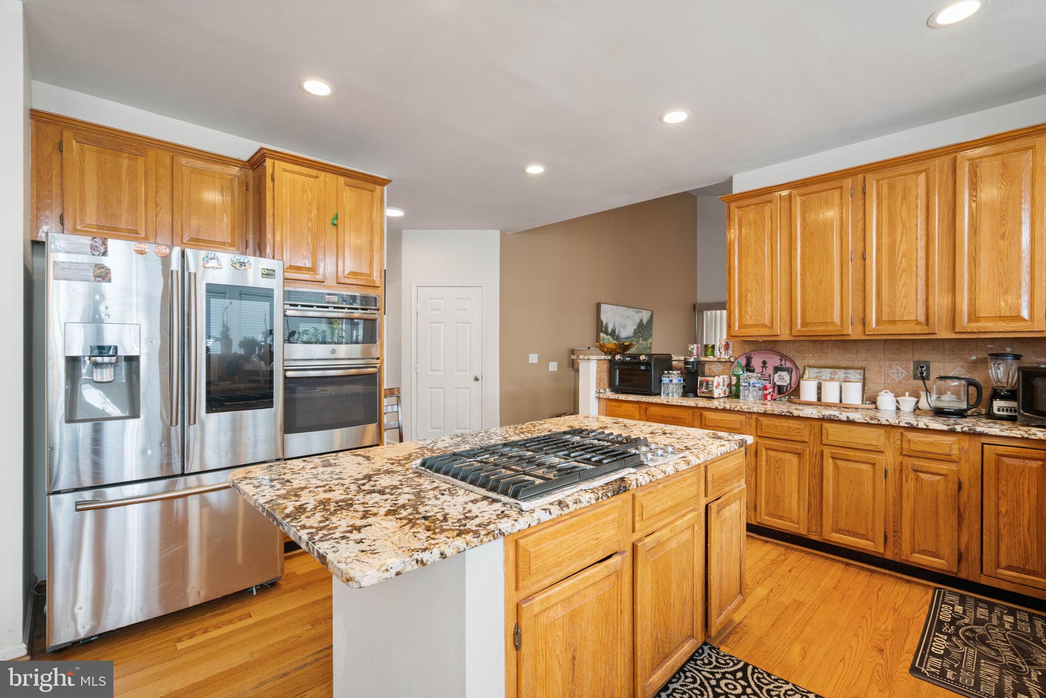 7616 Seabrook Lane Springfield, VA 22153 - Photo 11 of 35 Modern kitchen with warm wood tones.