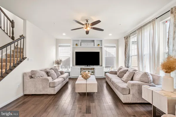 a living room with furniture fireplace and a flat screen tv
