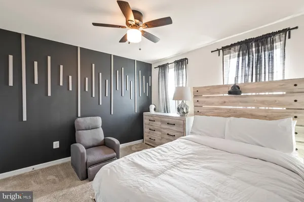 a bedroom with bed and window