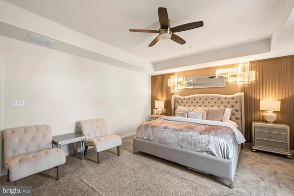 a bedroom with a bed and a couch