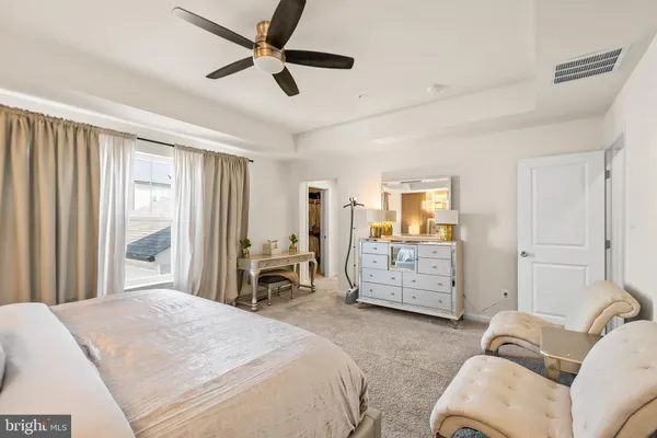 a bedroom with furniture and a window