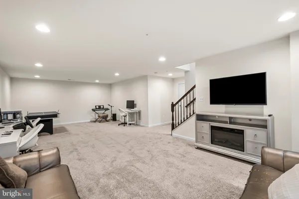 a view of a livingroom with furniture and a flat screen tv