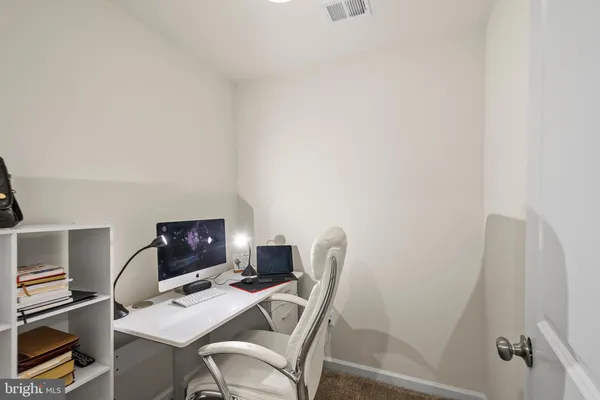 a view of a workspace with furniture