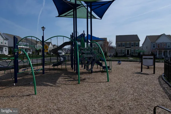 a view of a house with wooden fence