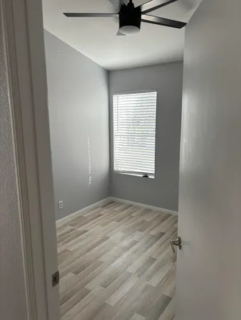 a view of an empty room with a window