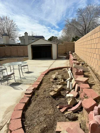 a view of a terrace with wooden fence