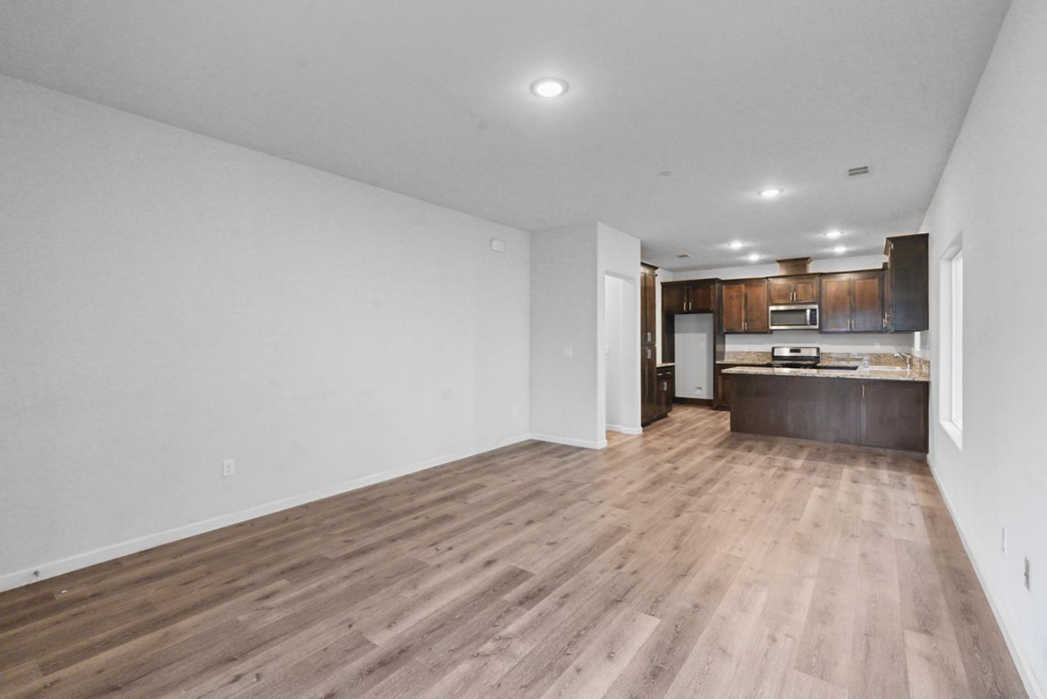 683 Granada Court Merced, CA 95341 - Photo 2 of 9 a view of kitchen with wooden floor