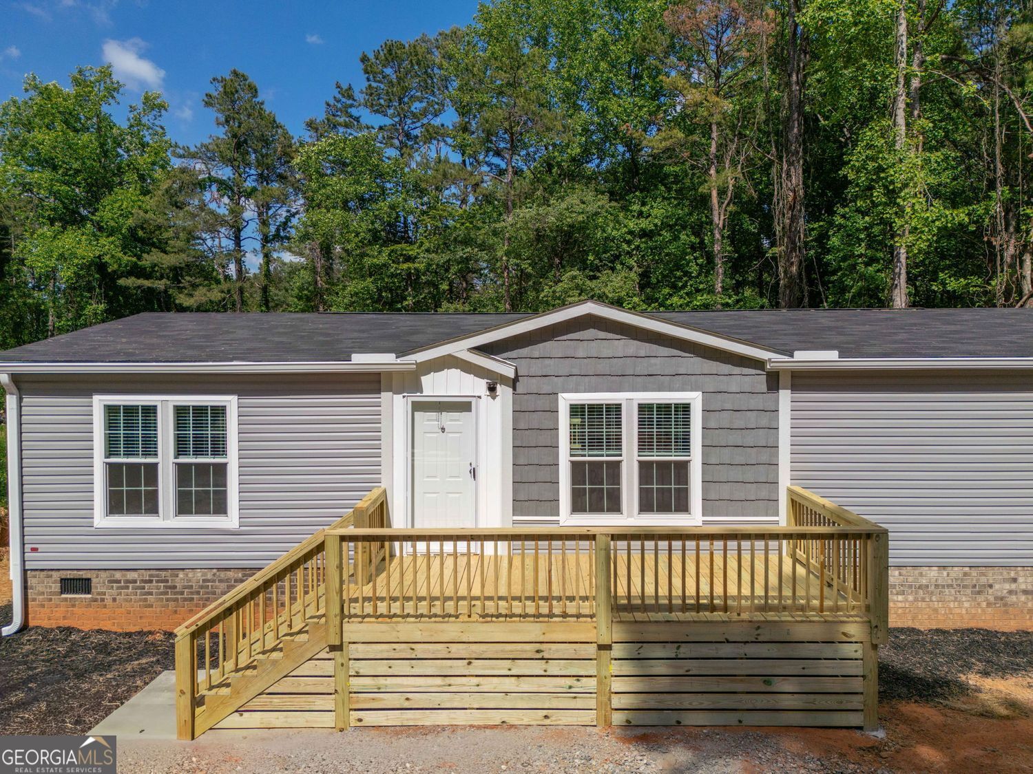 734 Hollywood Church Road Clarkesville, GA 30523 - Photo 2 of 49 a view of a house with a deck