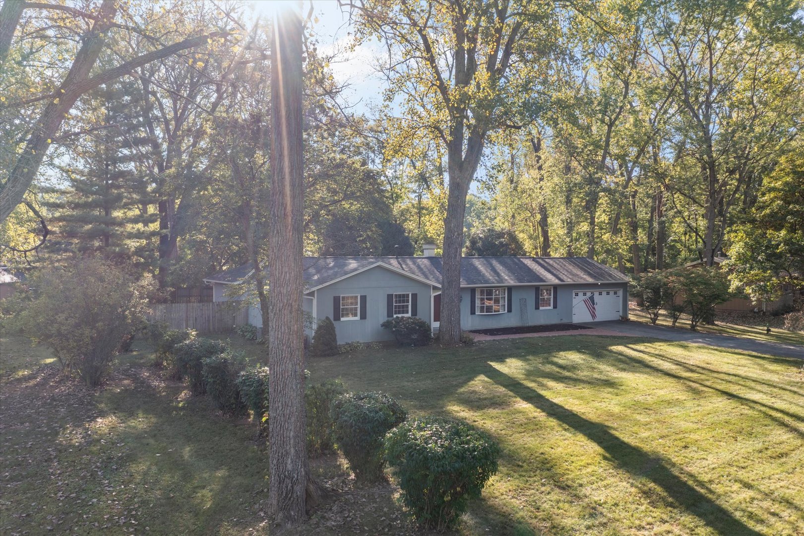 1108 Riverside Court Mahomet, IL 61853 - Photo 45 of 50 a view of a house with a yard and large trees