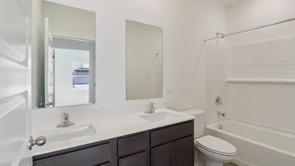 a bathroom with a sink toilet a vanity and shower