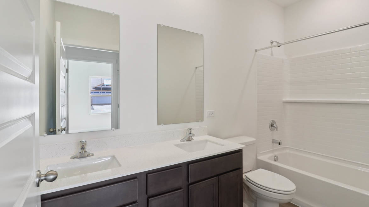 1107 Bluebell Lane Bartlett, IL 60103 - Photo 15 of 19 a bathroom with a sink toilet a vanity and shower