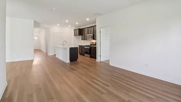 a view of kitchen with wooden floor