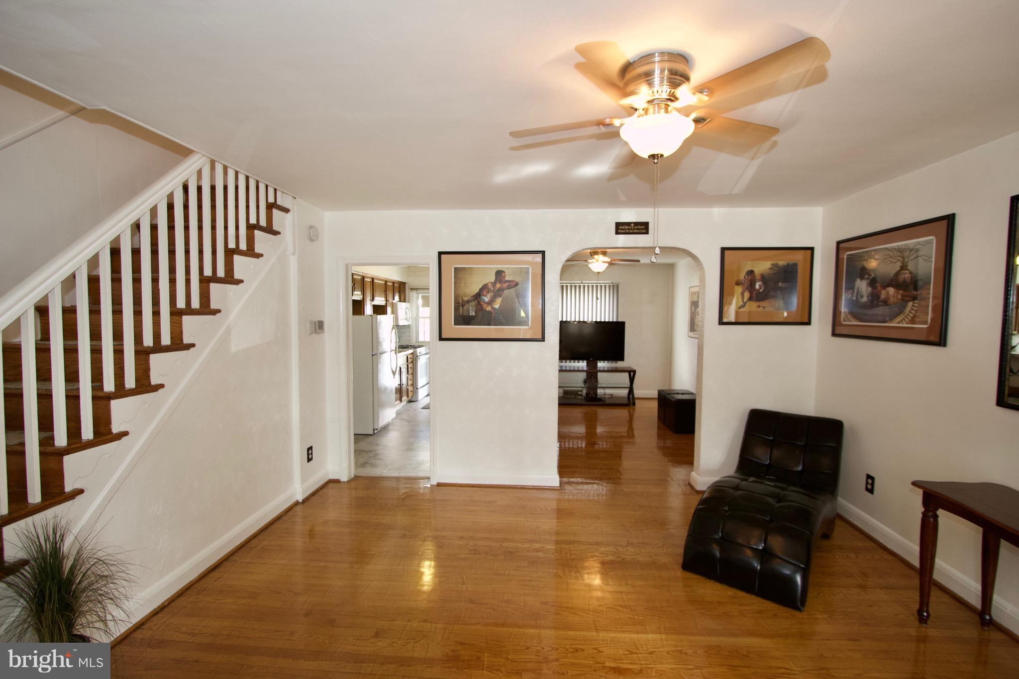 134 North Culver Street Baltimore, MD 21229 - Photo 14 of 30 a living room with furniture and wooden floor