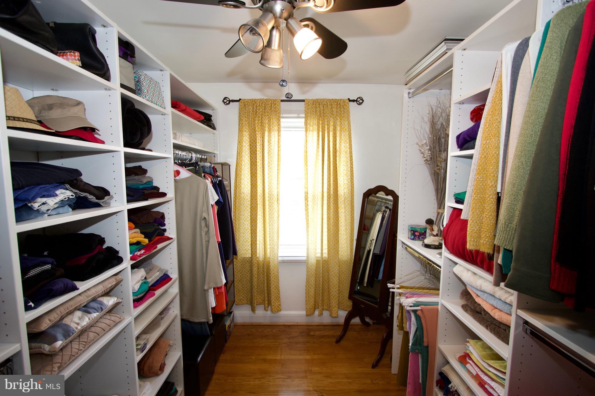 134 North Culver Street Baltimore, MD 21229 - Photo 18 of 30 a view of walk in closet with clothes and shoes