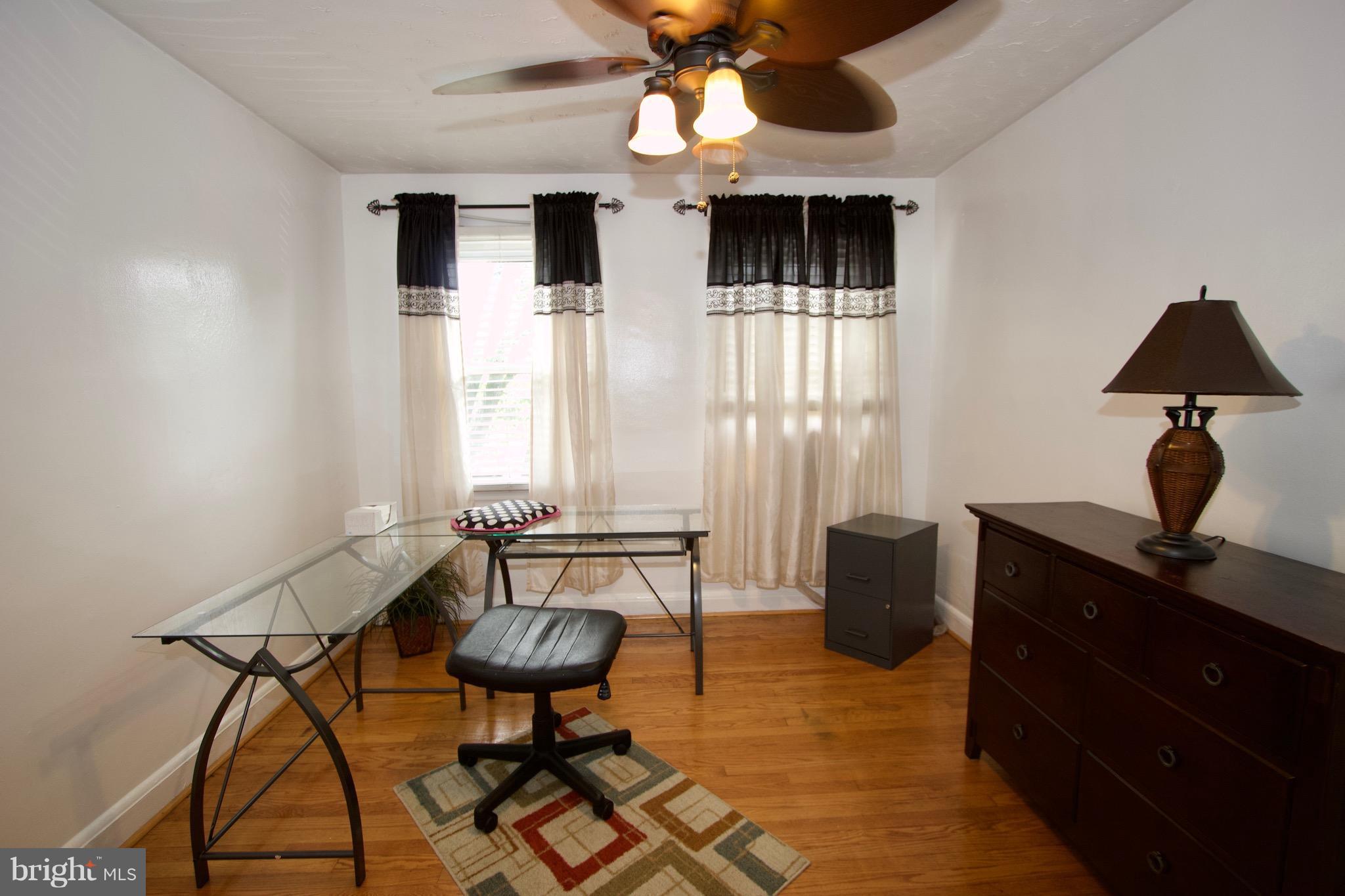 134 North Culver Street Baltimore, MD 21229 - Photo 19 of 30 a living room with furniture and a window