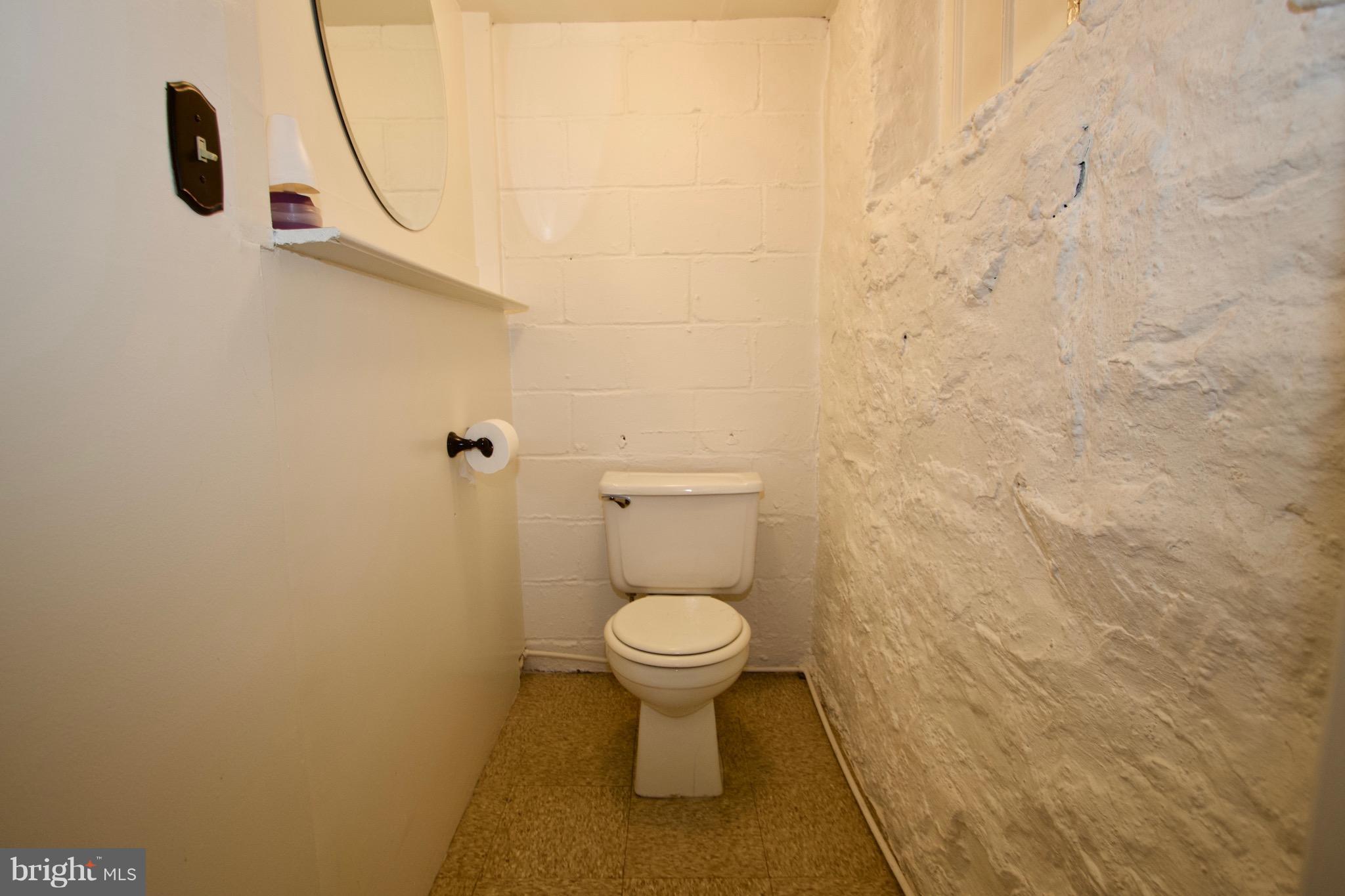 134 North Culver Street Baltimore, MD 21229 - Photo 26 of 30 a bathroom with a toilet and a sink