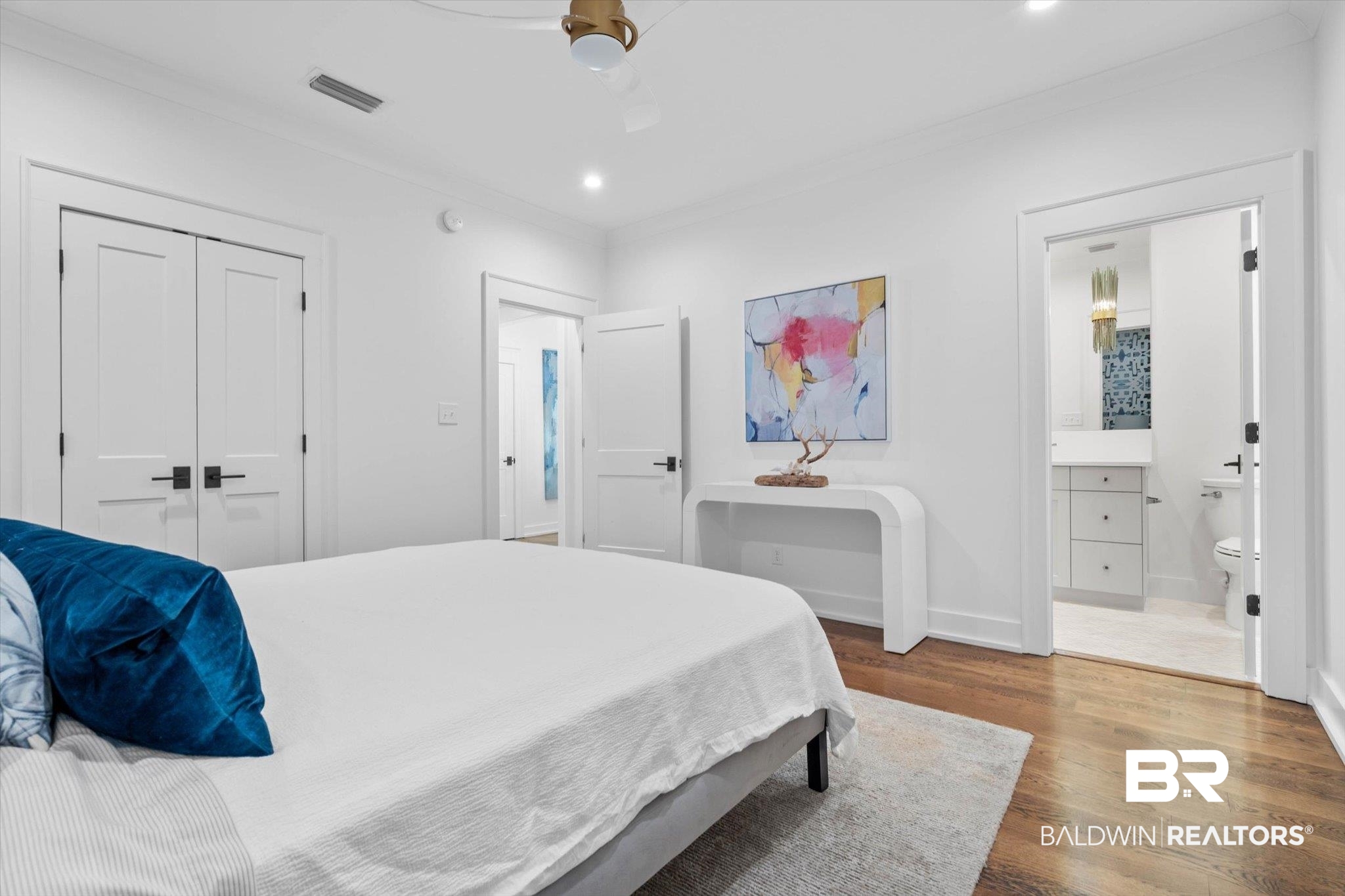 4602 Kingswood Drive Mobile, AL 36608 - Photo 24 of 45 Bedroom featuring wood finished floors, crown molding, ensuite bath, a closet, and a ceiling fan