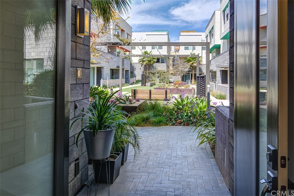 Looking out from your double door onto the community courtyard